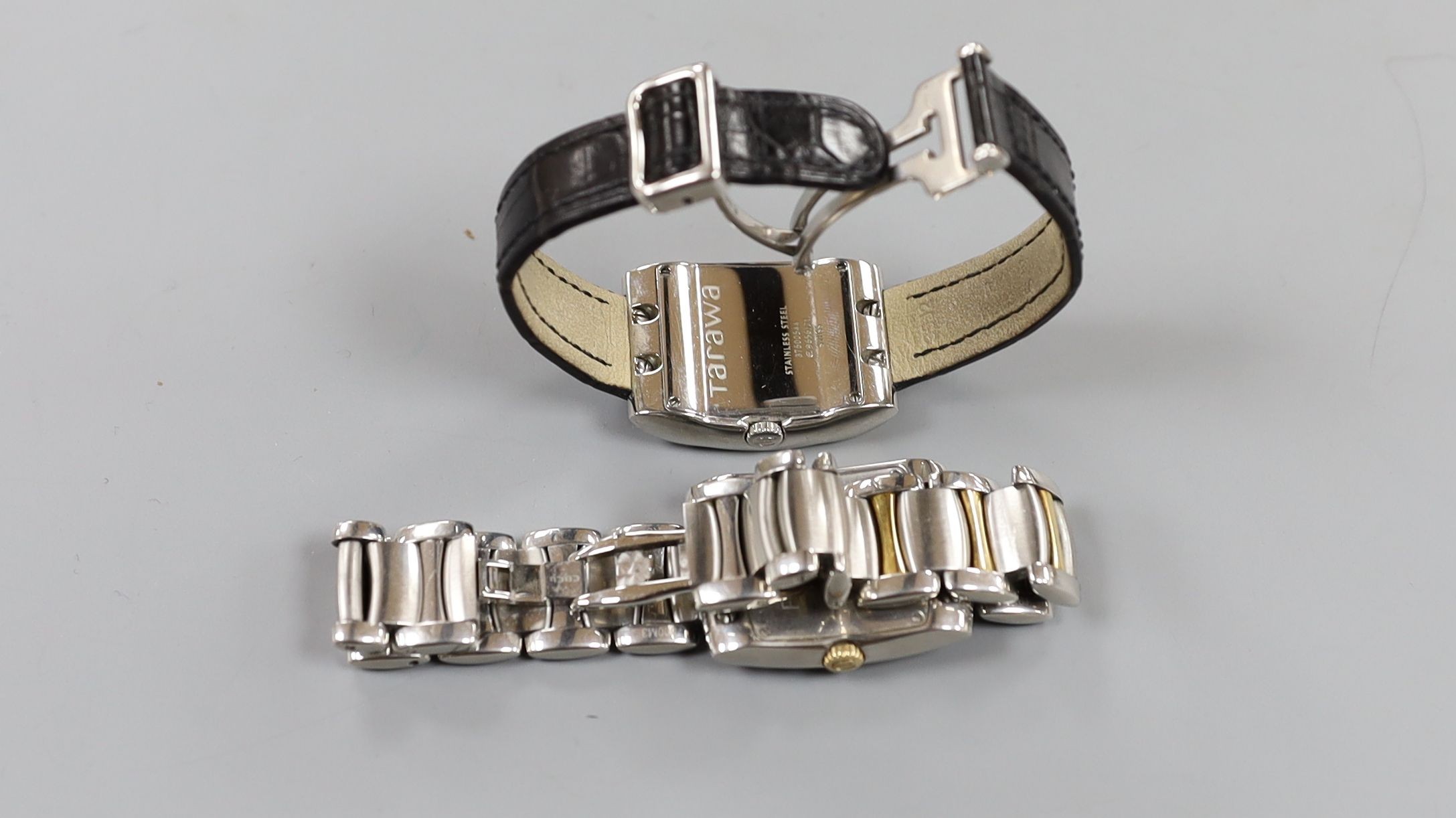 Two modern steel Ebel quartz wrist watches, Tarawa with leather strap and Brasilia with two tone bracelet, both with boxes.